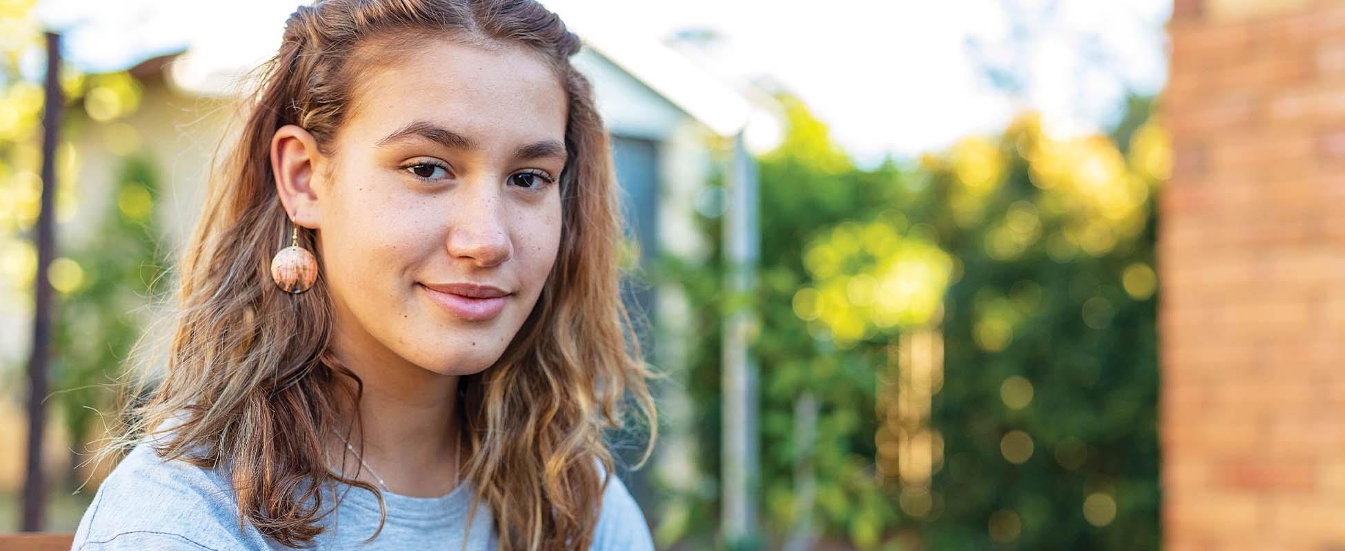 woman looking at camera smiling
